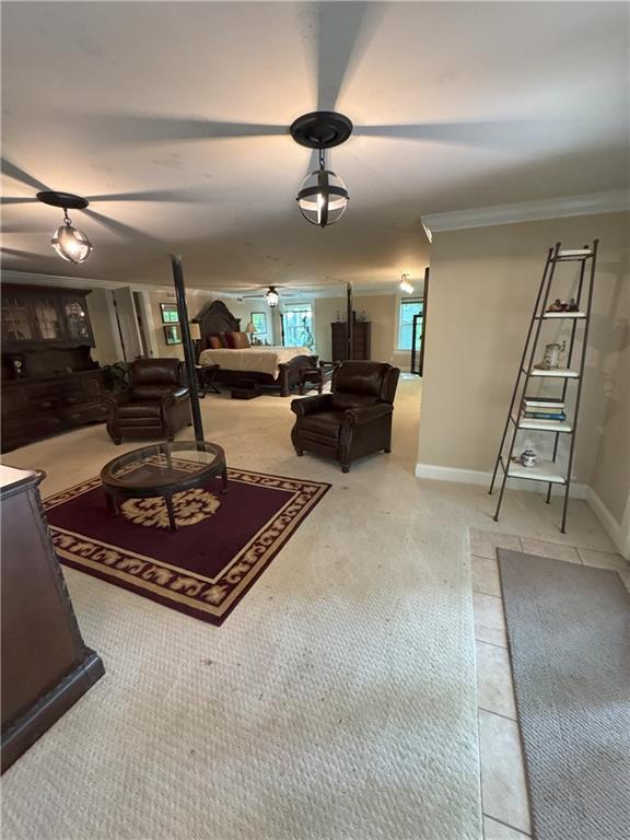 334 Eagle Cir, Dillard, GA 30537 - living room with ornamental molding, carpet, and baseboards