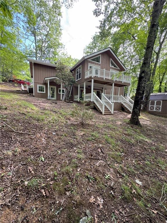 334 Eagle Cir, Dillard, GA 30537 - back of property featuring stairway and a porch