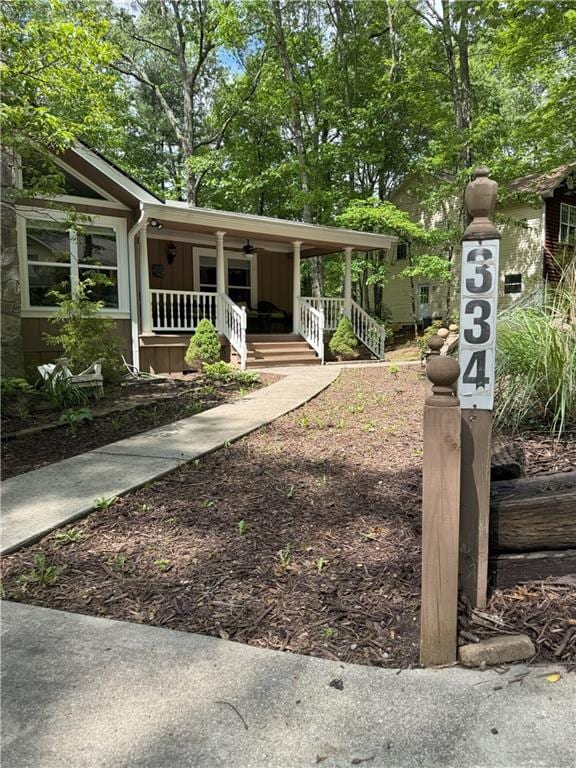 334 Eagle Cir, Dillard, GA 30537 - view of front of property with covered porch and board and batten siding