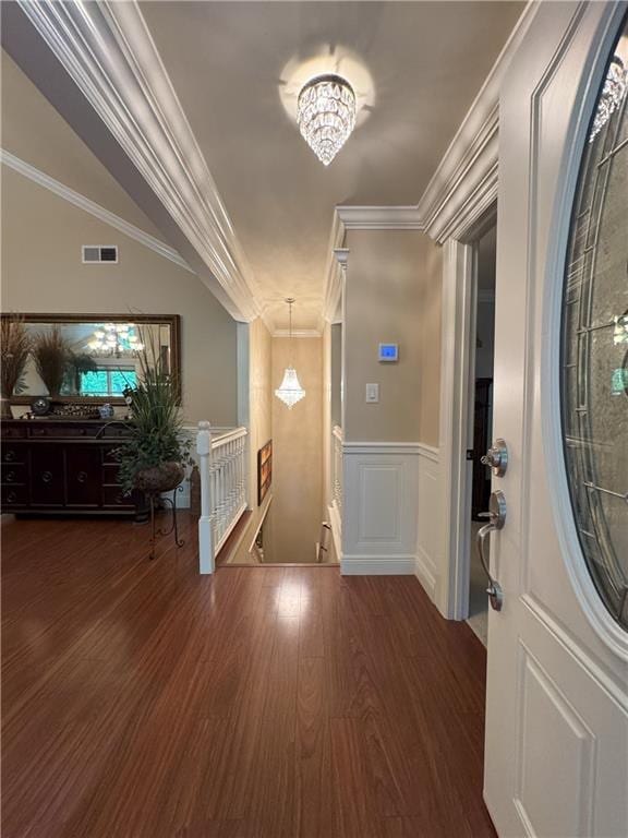 334 Eagle Cir, Dillard, GA 30537 - foyer with wood finished floors, ornamental molding, a chandelier, and wainscoting