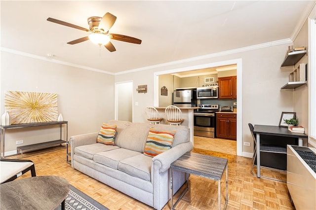 living room featuring baseboards, ceiling fan, and ornamental molding