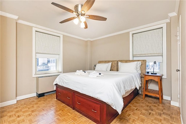 bedroom with crown molding, multiple windows, and baseboards