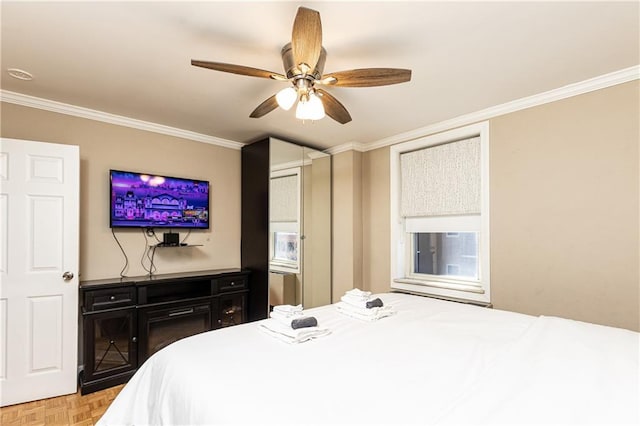 bedroom featuring ornamental molding and a ceiling fan