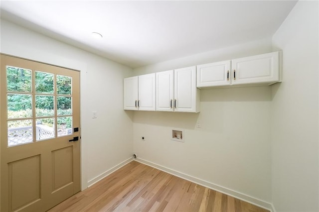 washroom with hookup for a washing machine, cabinets, light wood-type flooring, and hookup for an electric dryer