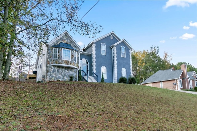 view of property with a front lawn