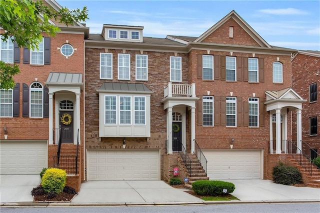 2513 Friar Tuck Ln SE Unit 1, Atlanta, GA 30339 - view of front facade with a garage, concrete driveway, and brick siding
