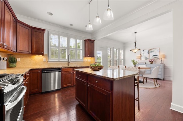2513 Friar Tuck Ln SE Unit 1, Atlanta, GA 30339 - kitchen with stainless steel appliances, a sink, dark wood finished floors, a kitchen breakfast bar, and light stone countertops