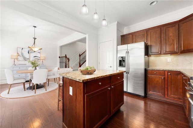 2513 Friar Tuck Ln SE Unit 1, Atlanta, GA 30339 - kitchen with stainless steel refrigerator with ice dispenser, dark wood-type flooring, light stone countertops, pendant lighting, and ornamental molding