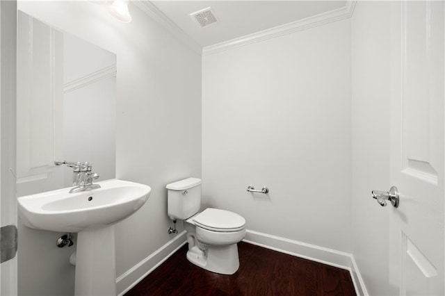2513 Friar Tuck Ln SE Unit 1, Atlanta, GA 30339 - bathroom featuring baseboards, ornamental molding, toilet, and wood finished floors