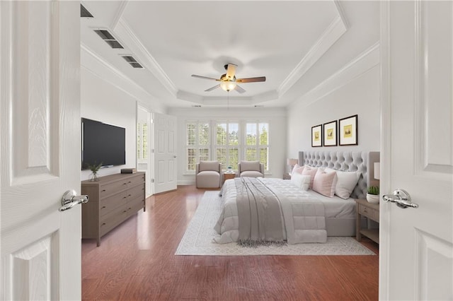 2513 Friar Tuck Ln SE Unit 1, Atlanta, GA 30339 - bedroom featuring wood finished floors, crown molding, a raised ceiling, and ceiling fan