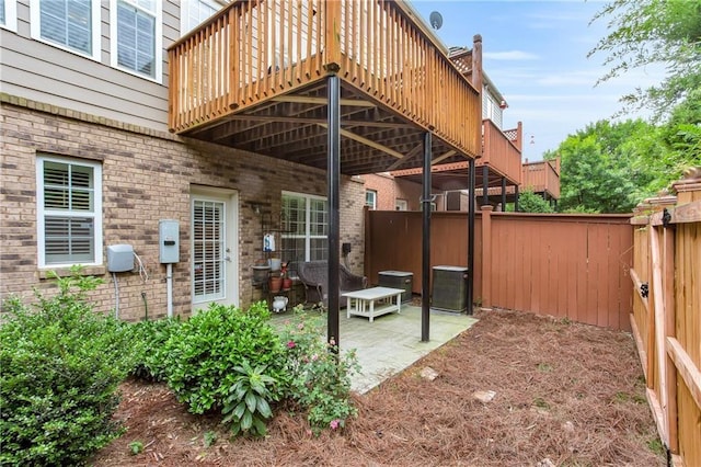 2513 Friar Tuck Ln SE Unit 1, Atlanta, GA 30339 - view of patio with central AC, a wooden deck, and a fenced backyard