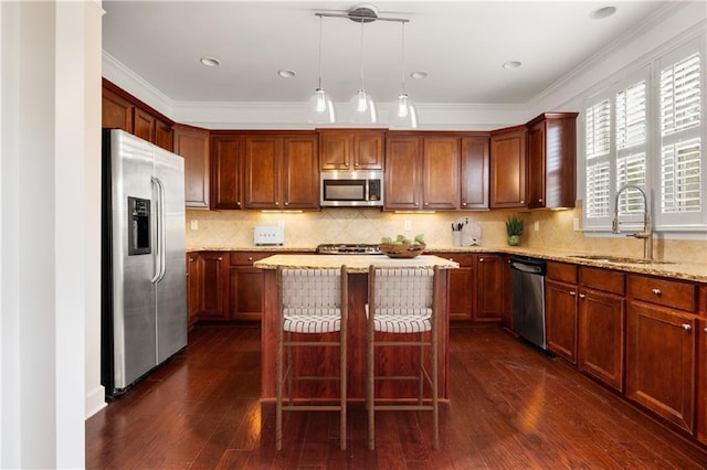 2513 Friar Tuck Ln SE Unit 1, Atlanta, GA 30339 - kitchen featuring appliances with stainless steel finishes, a sink, a kitchen island, light stone countertops, and dark wood-type flooring