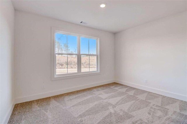 spare room featuring carpet flooring