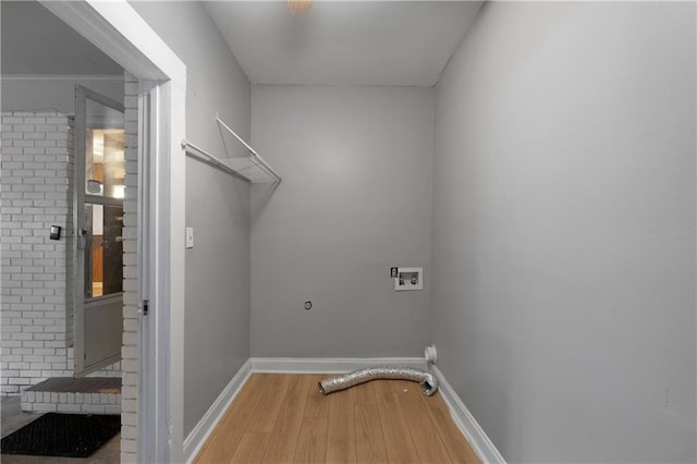 clothes washing area featuring washer hookup, hardwood / wood-style flooring, and hookup for an electric dryer