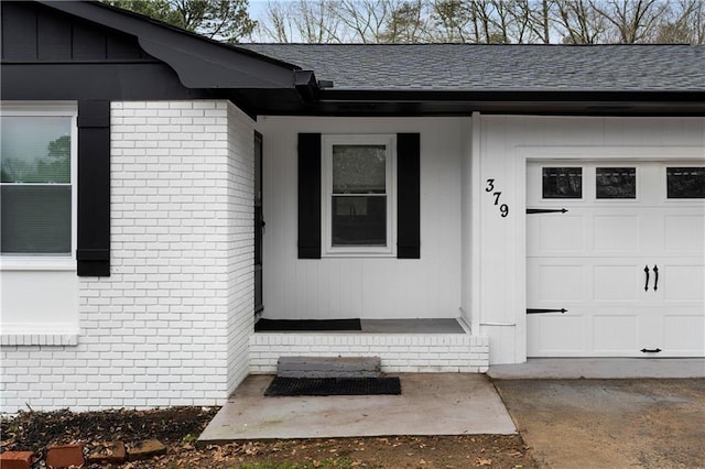 view of exterior entry featuring a garage