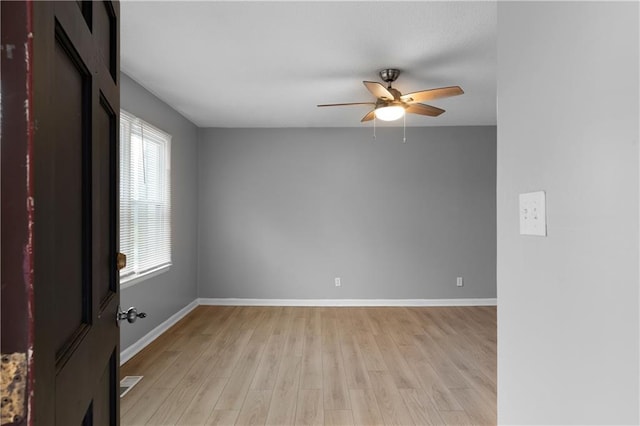 unfurnished room featuring light hardwood / wood-style floors and ceiling fan