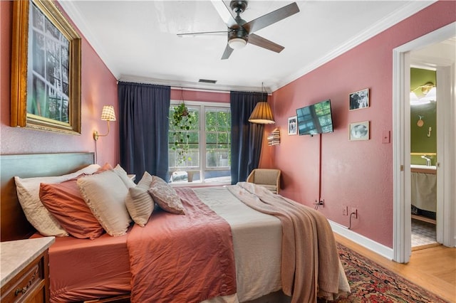 bedroom with hardwood / wood-style floors, ensuite bathroom, crown molding, and ceiling fan