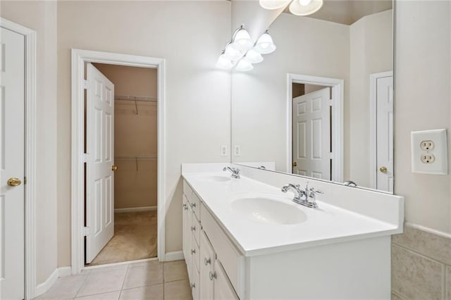 bathroom with dual bowl vanity and tile patterned floors