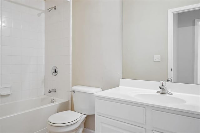 full bathroom featuring tiled shower / bath, toilet, and vanity