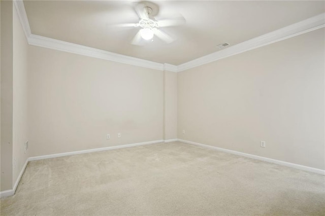 unfurnished room featuring ceiling fan, carpet, and ornamental molding