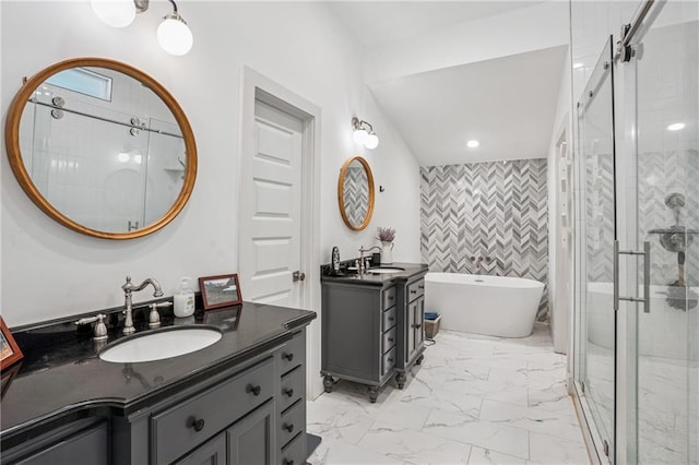 642 Erin Ave SW, Atlanta, GA 30310 - full bathroom featuring a stall shower, a freestanding bath, two vanities, marble finish floors, and tile walls