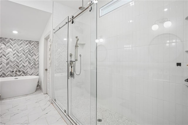 642 Erin Ave SW, Atlanta, GA 30310 - full bath with a stall shower, a freestanding bath, marble finish flooring, recessed lighting, and tile walls