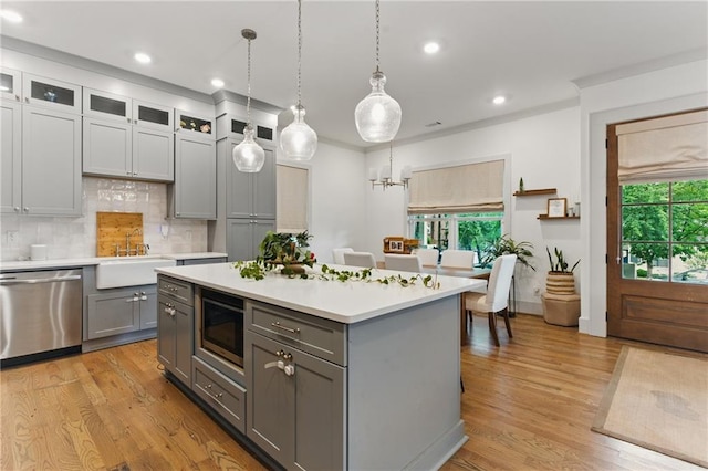 642 Erin Ave SW, Atlanta, GA 30310 - kitchen featuring stainless steel dishwasher, gray cabinetry, built in microwave, a sink, and light countertops