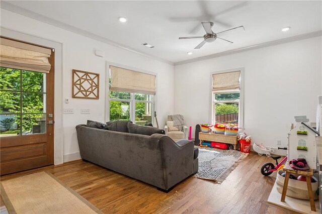642 Erin Ave SW, Atlanta, GA 30310 - living room featuring healthy amount of natural light, wood finished floors, ceiling fan, recessed lighting, and crown molding