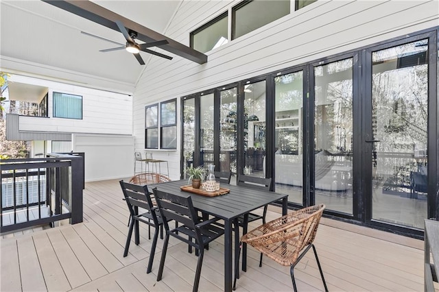 deck featuring outdoor dining area and a ceiling fan