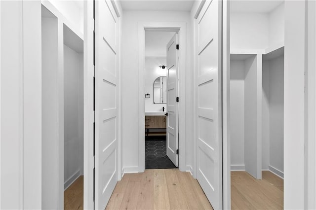 corridor featuring light wood-style floors