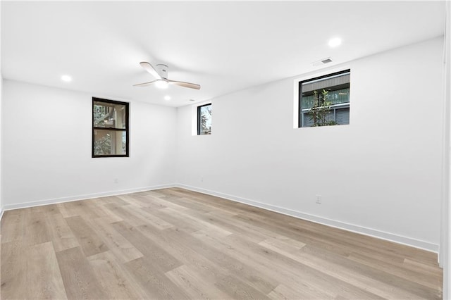 spare room featuring recessed lighting, visible vents, baseboards, and light wood-style flooring