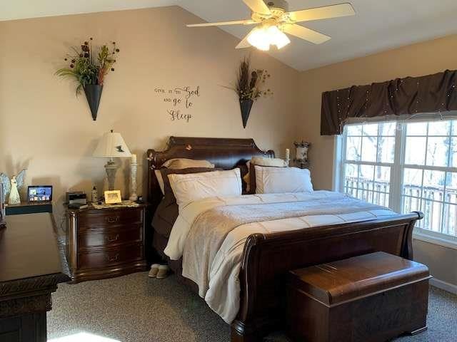 789 N Falling Waters Dr N, Demorest, GA 30535 - bedroom featuring vaulted ceiling, carpet flooring, and a ceiling fan