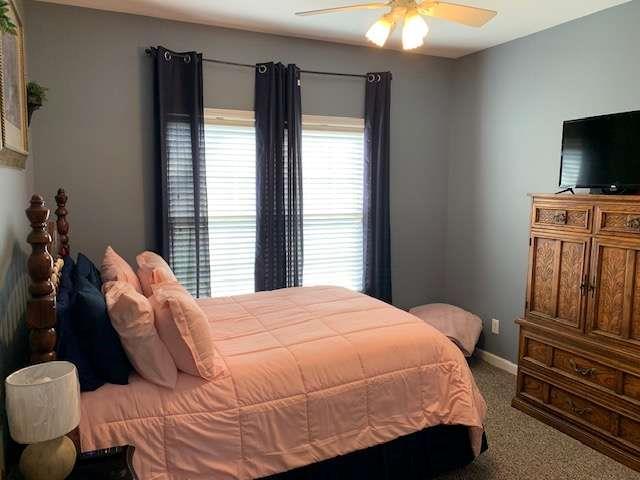 789 N Falling Waters Dr N, Demorest, GA 30535 - carpeted bedroom featuring baseboards and a ceiling fan