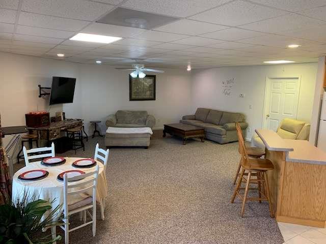 789 N Falling Waters Dr N, Demorest, GA 30535 - living room featuring ceiling fan, a paneled ceiling, and light carpet