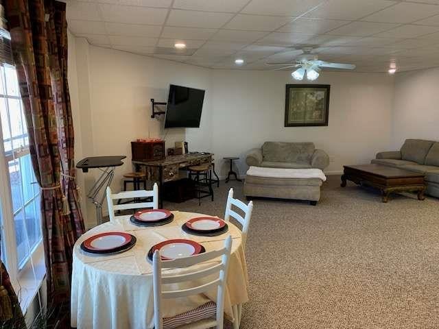 789 N Falling Waters Dr N, Demorest, GA 30535 - carpeted dining room featuring plenty of natural light, ceiling fan, a paneled ceiling, and baseboards