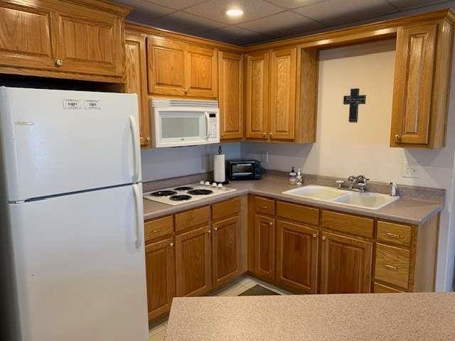 789 N Falling Waters Dr N, Demorest, GA 30535 - kitchen featuring white appliances, a sink, brown cabinetry, light countertops, and recessed lighting