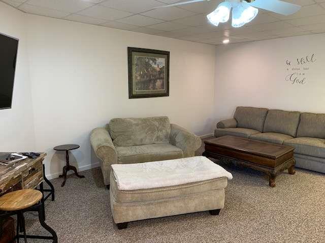 789 N Falling Waters Dr N, Demorest, GA 30535 - carpeted living area with ceiling fan, a drop ceiling, and baseboards