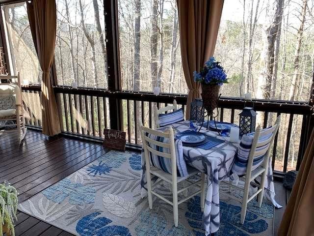 789 N Falling Waters Dr N, Demorest, GA 30535 - wooden deck with outdoor dining space and a view of trees
