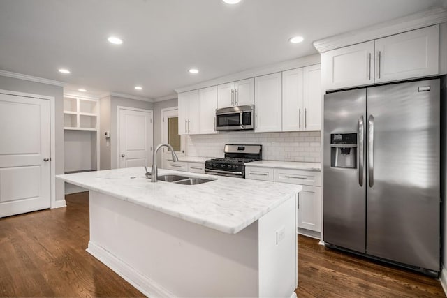 kitchen with backsplash, appliances with stainless steel finishes, dark wood finished floors, and a sink