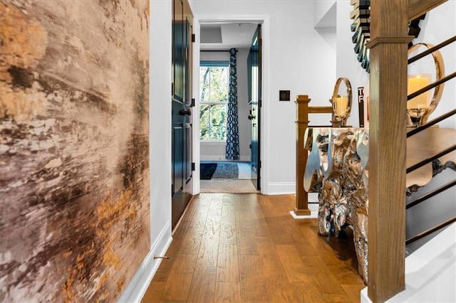 entryway with hardwood / wood-style floors