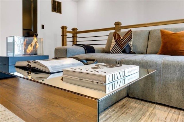 sitting room featuring wood-type flooring