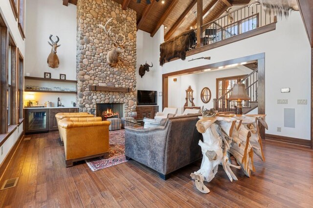 975 Blalock Lakes Dr, Newnan, GA 30263 - living room featuring wood ceiling, visible vents, dark wood-style flooring, and beamed ceiling