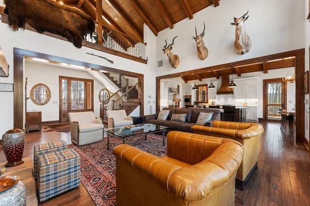 975 Blalock Lakes Dr, Newnan, GA 30263 - living area featuring dark wood-style floors, stairway, wooden ceiling, and beam ceiling