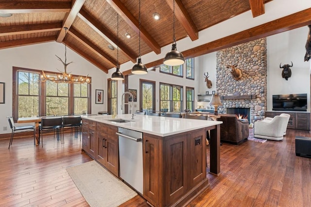 975 Blalock Lakes Dr, Newnan, GA 30263 - kitchen featuring high vaulted ceiling, dark wood finished floors, dishwasher, and a sink
