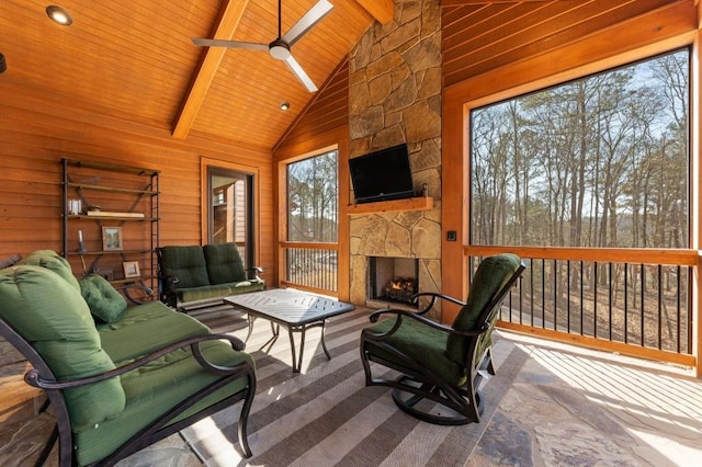 975 Blalock Lakes Dr, Newnan, GA 30263 - sunroom with wood ceiling, an outdoor stone fireplace, vaulted ceiling with beams, and ceiling fan
