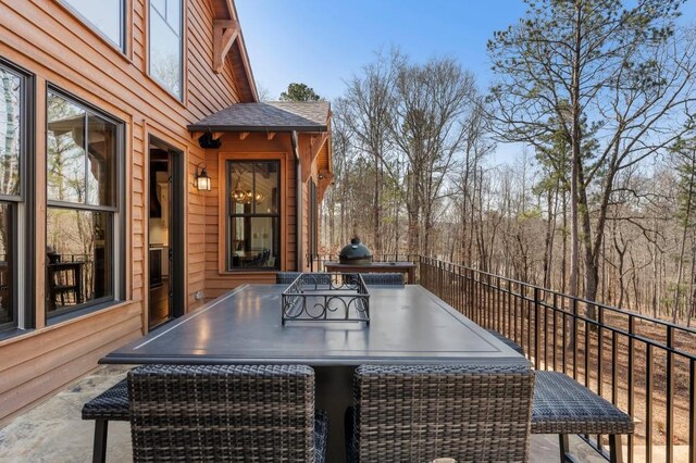 975 Blalock Lakes Dr, Newnan, GA 30263 - wooden deck with an outdoor kitchen and outdoor dining area