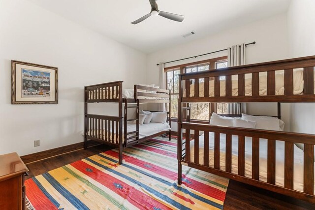 975 Blalock Lakes Dr, Newnan, GA 30263 - bedroom featuring visible vents, baseboards, and wood finished floors