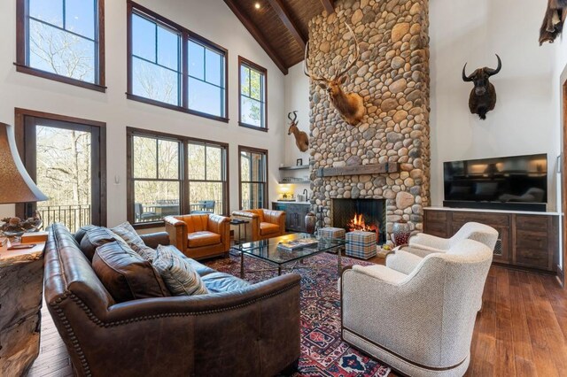 975 Blalock Lakes Dr, Newnan, GA 30263 - living room featuring high vaulted ceiling, wooden ceiling, hardwood / wood-style flooring, a fireplace, and beam ceiling