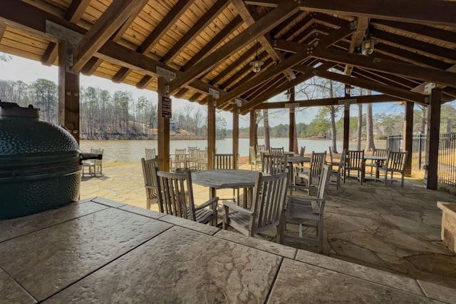 975 Blalock Lakes Dr, Newnan, GA 30263 - view of patio featuring outdoor dining space and a water view