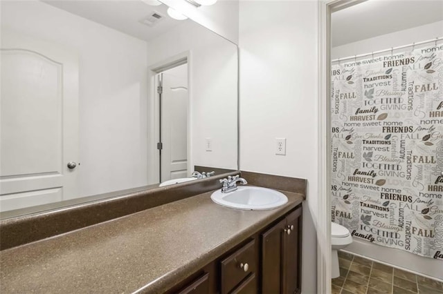 full bathroom with visible vents, vanity, and toilet